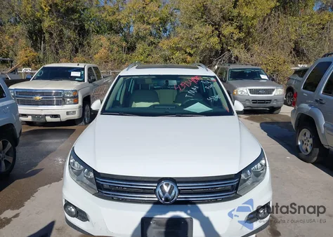 2014 Volkswagen Tiguan Sel z USA, uszkodzony, nr VIN WVGAV3AX2EW557592
